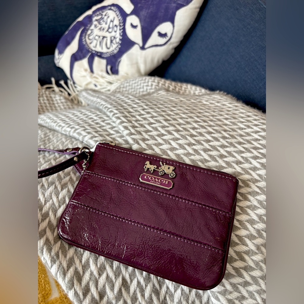 Coach - patent aubergine wristlet